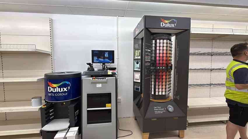 Dulux paint mixing station and decorating supplies in the shop